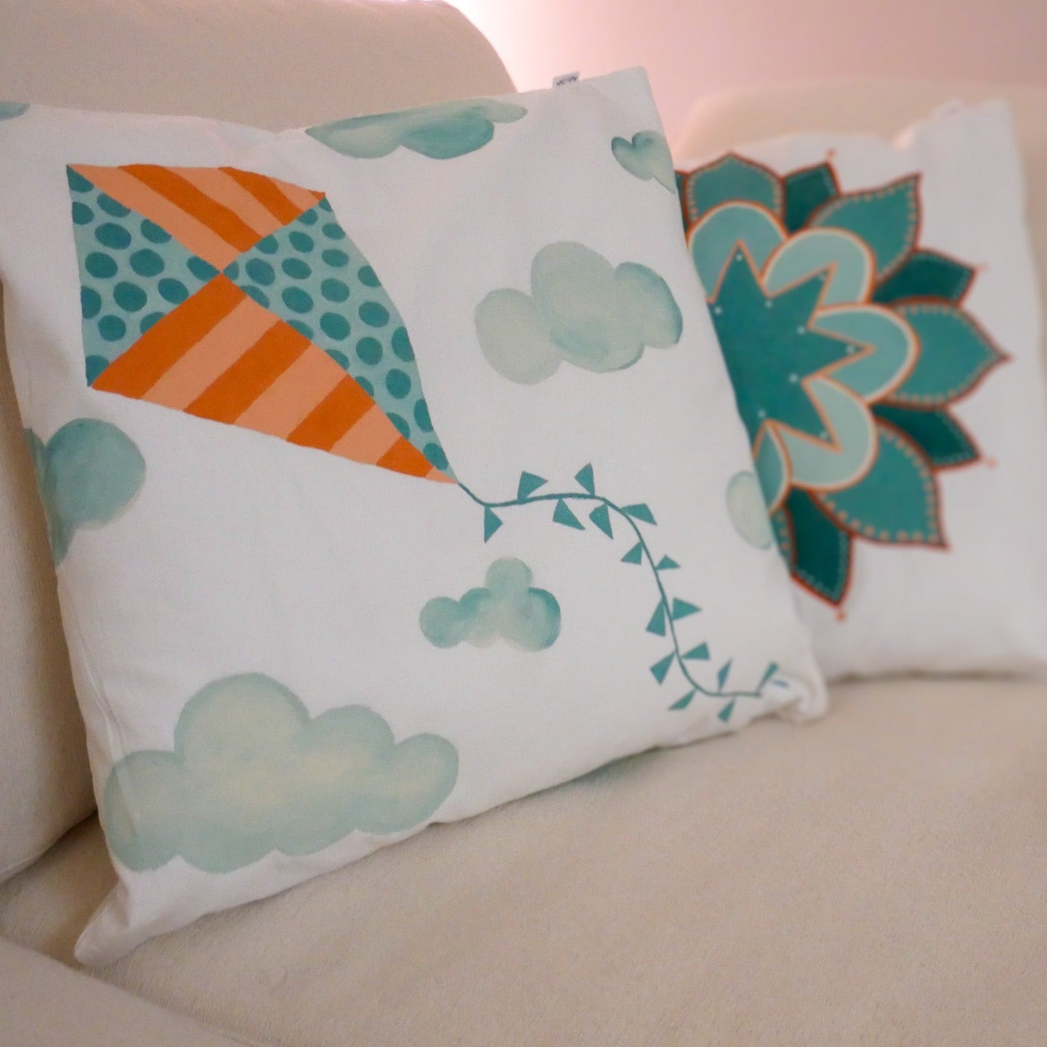 Teal shops and orange throw pillows